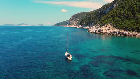 Drone Flying Over Sailboat At Agios Ioannis Skopelos Beach Greece