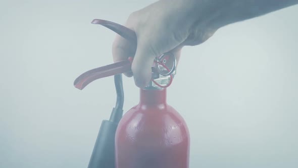 Fire Extinguisher Picked Up In Smoke Moving Shot
