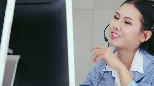 Customer Support Agent or Call Center with Headset Talking to Customer on Phone