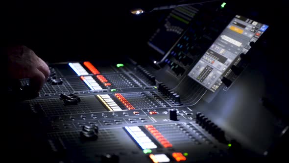 Person operating sound editing table, panoramic view