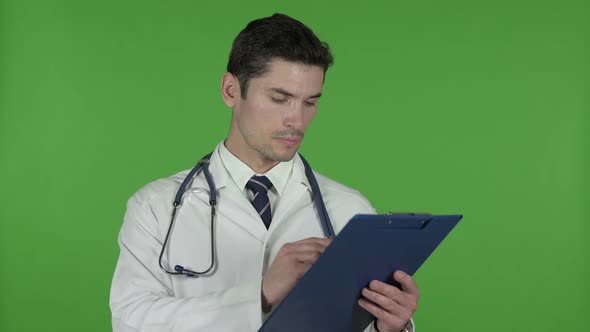 Doctor Going Through Checklist Documents Chroma Key
