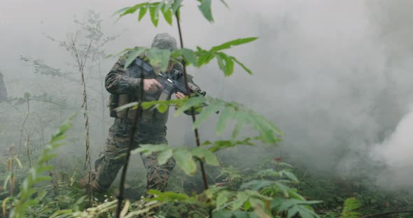 Concept of Millitary or Army Action in Forest with Smoke in Backgorund
