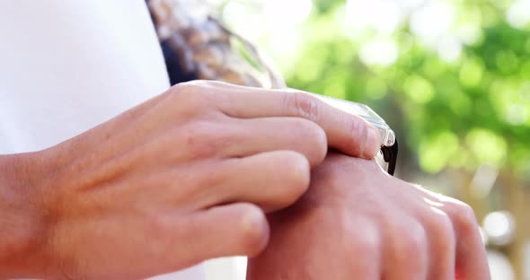 Close-up of hand tapping on smartwatch