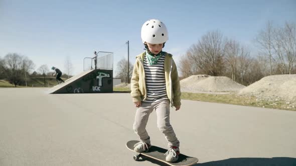 Young boy skating in skate park