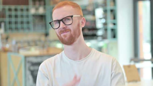 Portrait of Rejecting Sign By Redhead Man, Arm 