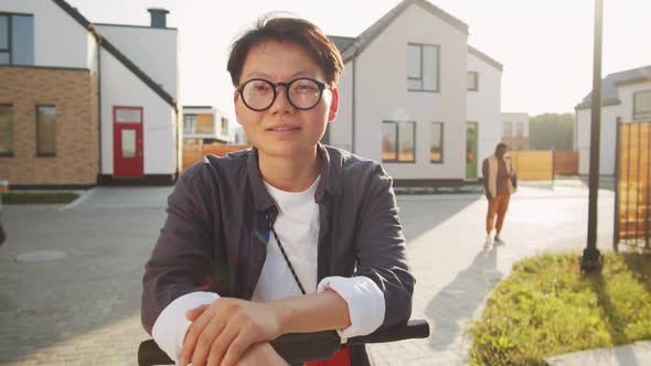 Portrait of Young Asian Woman with E-Scooter on Street