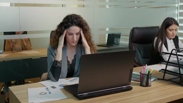 Coworker feeling fatigue after a hard day at work.