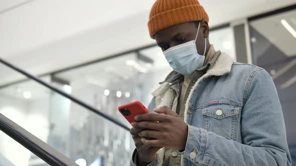 Professional Shopper in Disposable Face Mask Types on Phone