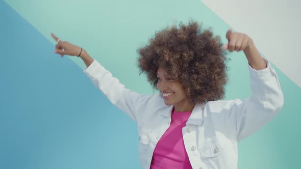 Beautiful young woman with curly hairstyle and fashionable clothes