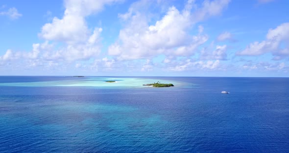 Beautiful flying abstract view of a paradise sunny white sand beach and turquoise sea background in 