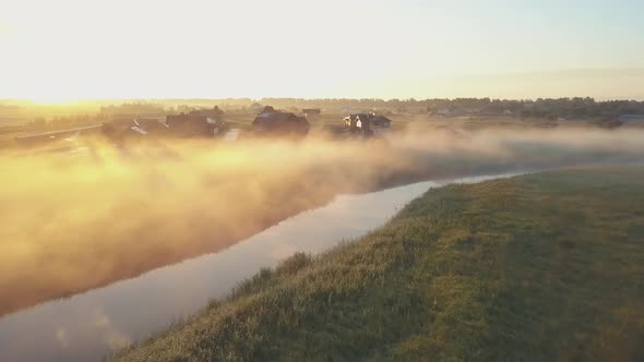 Aerial View of the Fog Over the River at Dawn