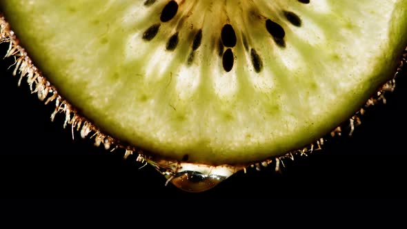 Juicy Kiwi Slice on Black Background