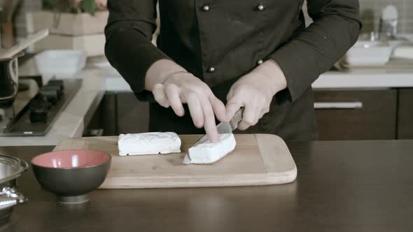 Chef cuts cheese