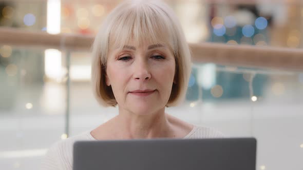 Closeup Mature Successful Confident Businesswoman Sitting at Workplace Working on Laptop Busy