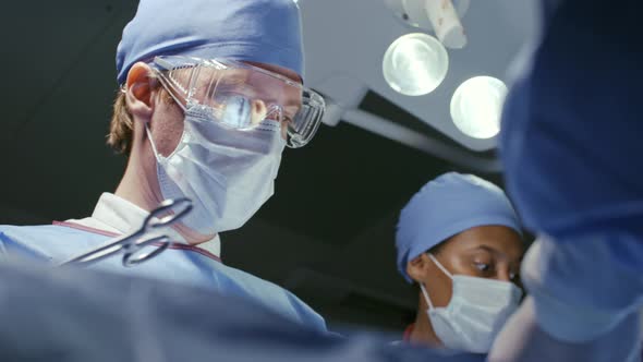 Male Surgeon Working in Operating Room