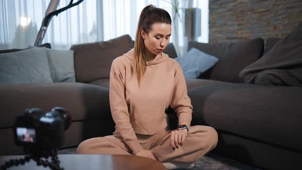 Female Yoga Blogger Filming Video Tutorial How To Breathe Using Smart Watch App