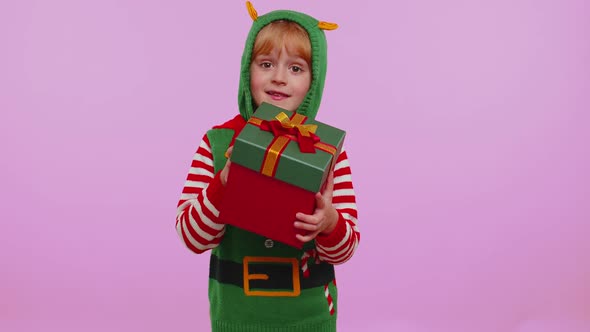 Funny Teen Toddler Girl Kid in Christmas Santa Costume Presenting Christmas Gift Box Shopping Sale