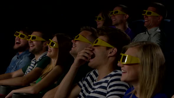 Young People Watch Movies in Cinema: Comedy in 3D. Close Up