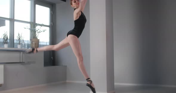 Pretty Ballet Dancer Does Big Jump in Dance Studio in Slow Motion, Ballet Rehearsal, Ballerina Does