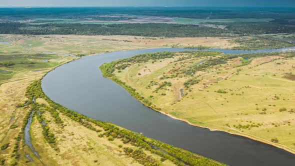 Rechytsa, Gomel Region, Belarus. Aerial View Of Dnieper River. Sky Above Green Meadow And River