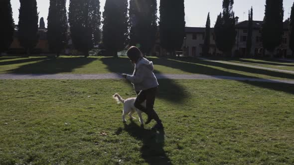 Woman with the dog at the park