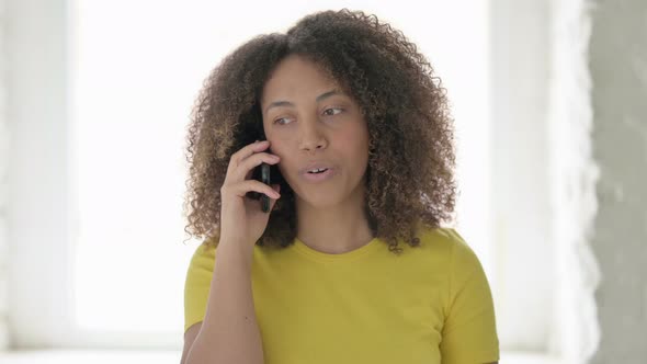 African Woman Talking on Phone