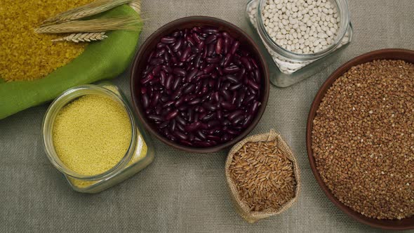 Putting Bowls with Buckwheat and Chickpeas on Table Top View