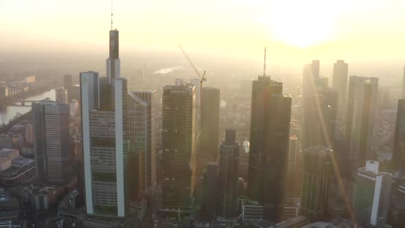 AERIAL: View of Frankfurt Am Main, Germany Skyline with Sunflair Between Skyscrapers in Beautiful