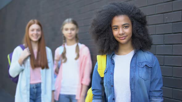 Female Pupils Smiling Camera