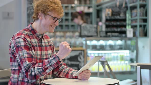 Winning, Young Redhead Man Celebrating Success on Tablet 