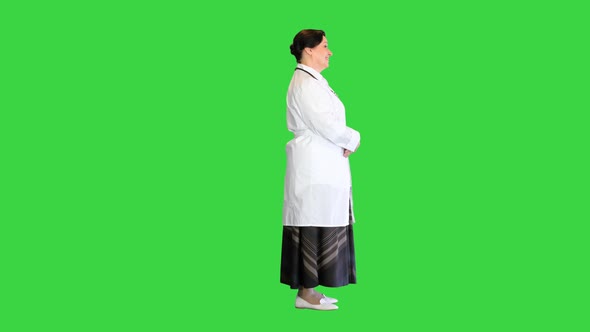 Happy Senior Female Doctor Standing on a Green Screen Chroma Key