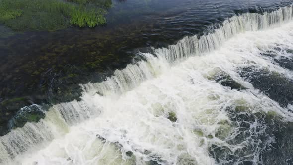 River Waterfall With Salmon Jumping Fish