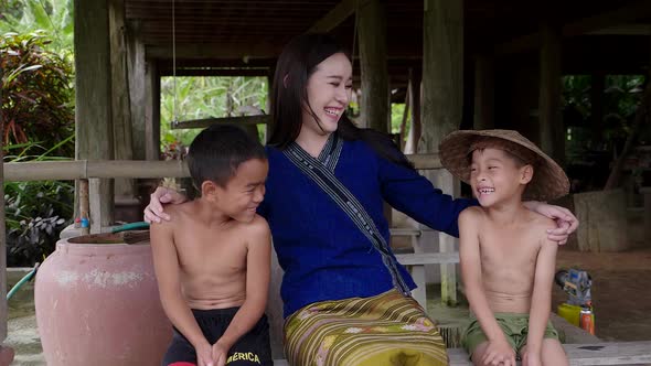 Happy Rural Asian Woman With Kids