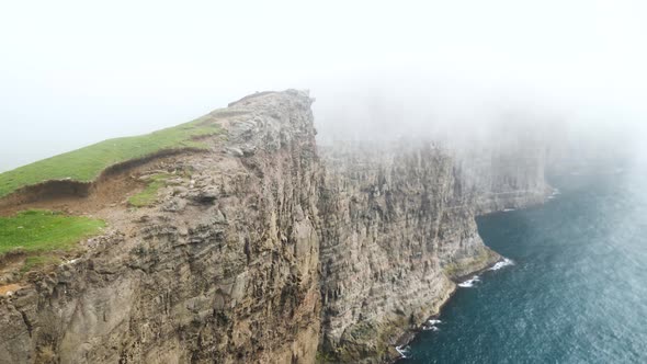 Beautiful View of Foggy Traelanipan Slave Mountain in Vagar Faroe Islands