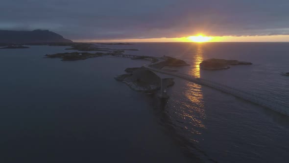 Atlantic Ocean Road in Norway at Summer Sunset. Car Is Passing on Storseisundet Bridge. Aerial View