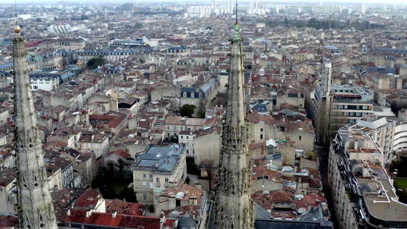 Gothic Cathedral spires in Bordeaux France, church dedicated to St. Andrew, Aerial pan left reveal s