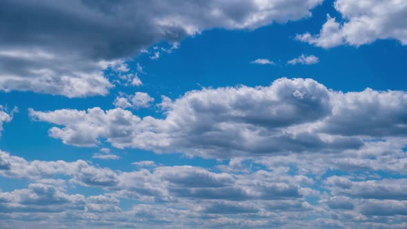 Timelapse of Layered Cumulus Clouds Moving in the Blue Sky