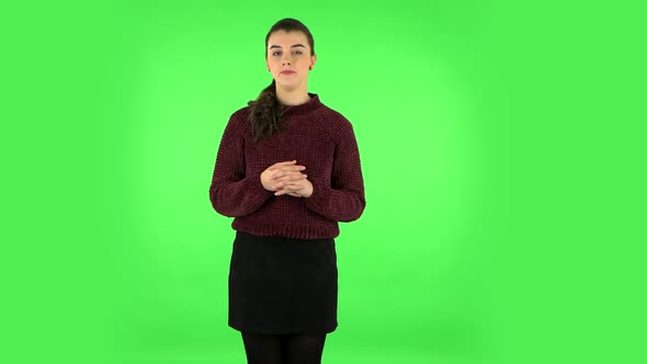 Woman in Anticipation of Worries, Then Guilty Hides His Eyes. Green Screen