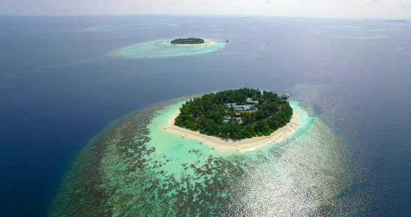 Aerial drone view of scenic tropical islands in the Maldives.