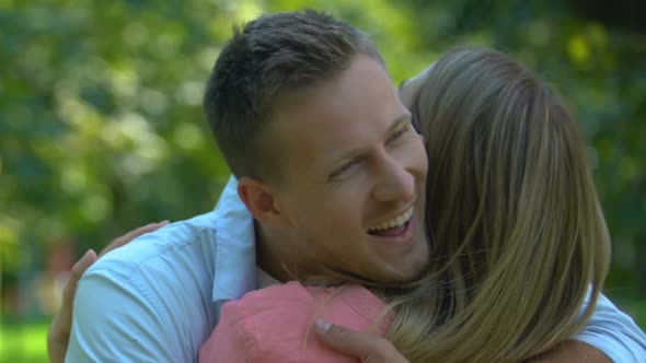 Smiling Boyfriend Tenderly Hugging His Girlfriend, Long-Awaited Meeting, Date