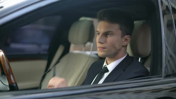 Man of Business Taking Off Glasses as Sitting in Car, Tired After Stressed Work