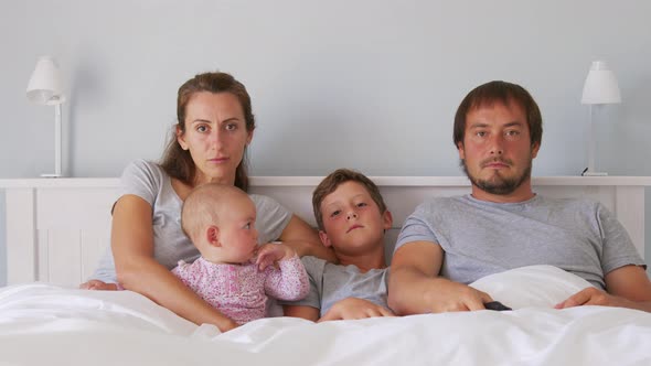 Family Watching Horror Movie at Late Evening at Stylish Apartments