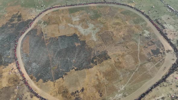 Aerial view of people watching horse race in Mohanpur, Bangladesh.