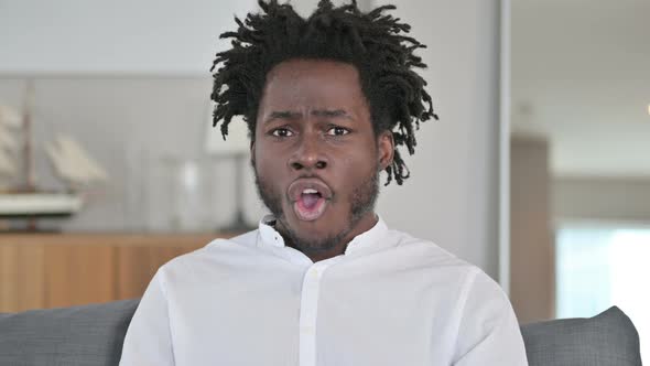 Portrait of Upset African Man Reacting To Loss 