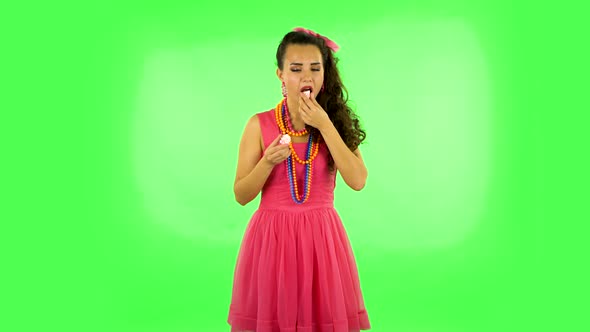Beautiful Woman with Pleasure Eating Sweet White Marshmallow, It's Not Tasty. Green Screen