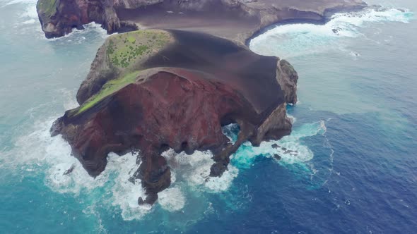 Aerial View of Steep Cliffs Washed with Blue Ocean Waters