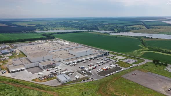 Aerial shot of large industrial complex. Modern factory background with parking place