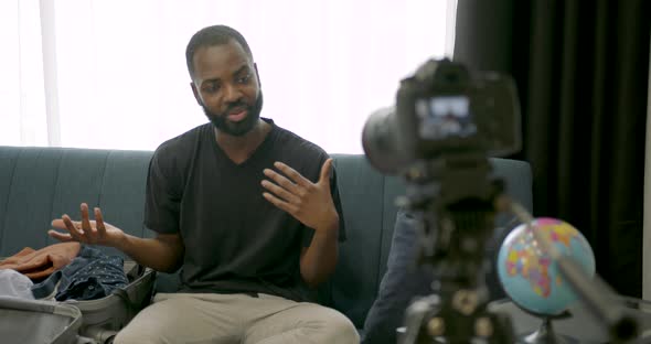 African Man Talking on Camera and Filming Blog