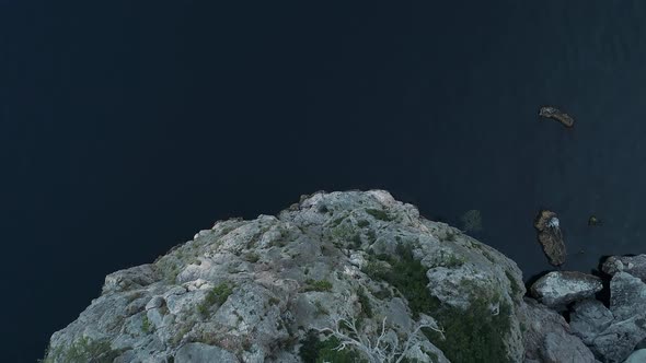 Calm blue sea surrounding rocks