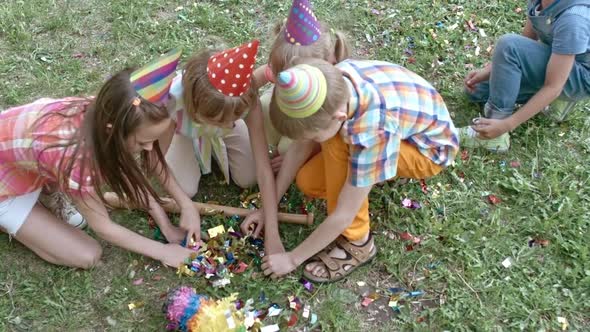 Kids Looking for Something In Pinata